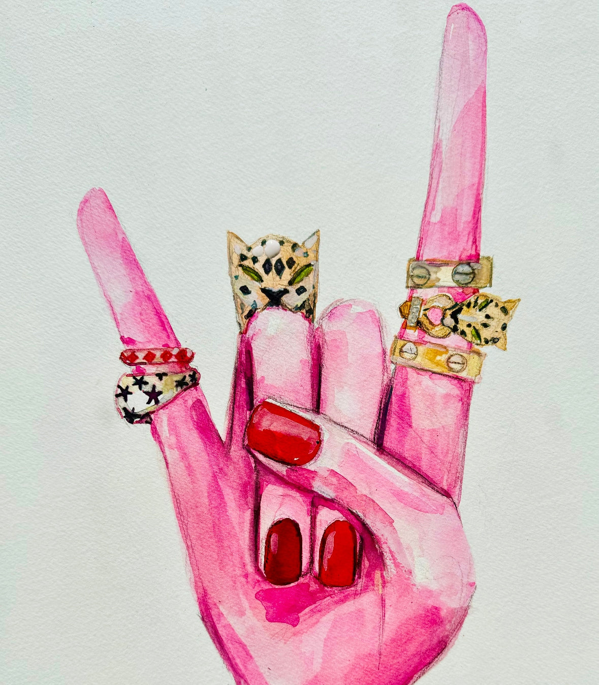 Pink hand with red nails and multiple rings on a light gray background